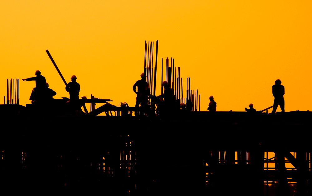 Construction-workers-working-onsite-during-sunset